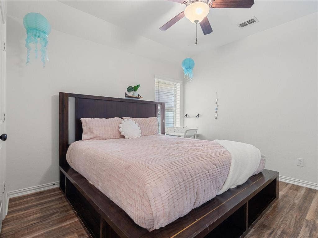 1506 Hennessey Drive, Allen, TX 75013 Bedroom with dark wood-type flooring and ceiling fan