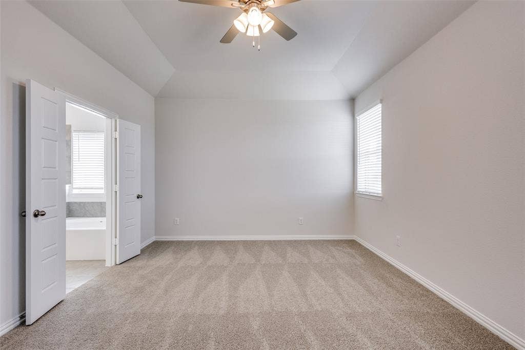 3325 Cross Shore Drive, Anna, TX 75409 Empty room with light colored carpet, baseboards, and a ceiling fan