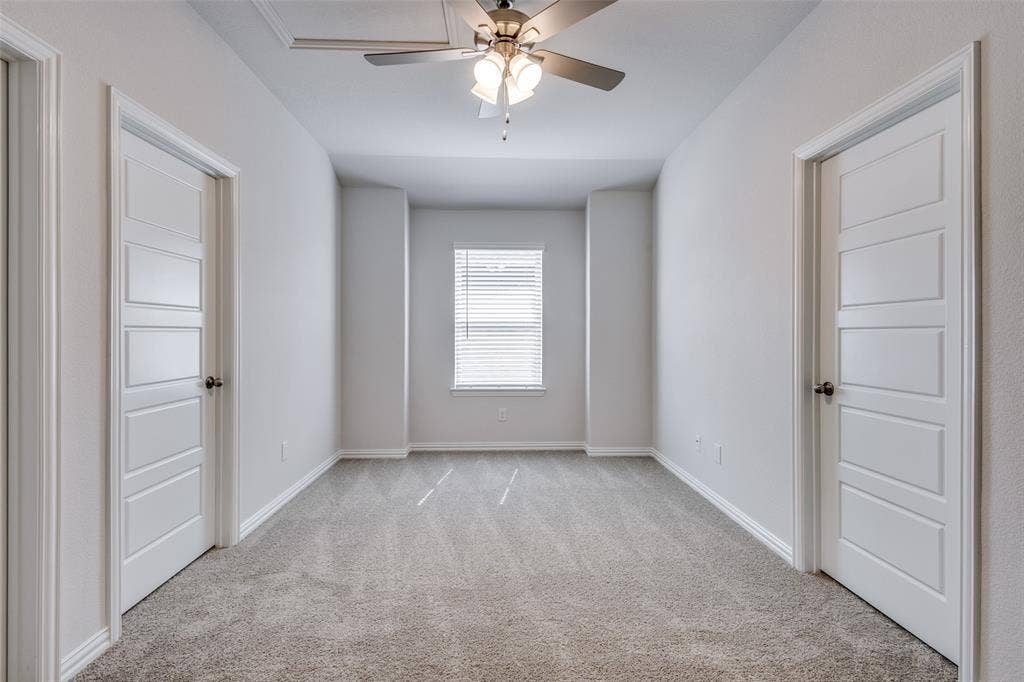3325 Cross Shore Drive, Anna, TX 75409 Unfurnished room featuring baseboards, light carpet, and ceiling fan