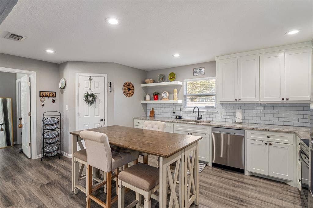 519 MAE Drive, Mabank, TX 75147 Kitchen featuring white shaker-style cabinetry, stone countertops, subway tile backsplash, recessed lighting, and wood-finish flooring