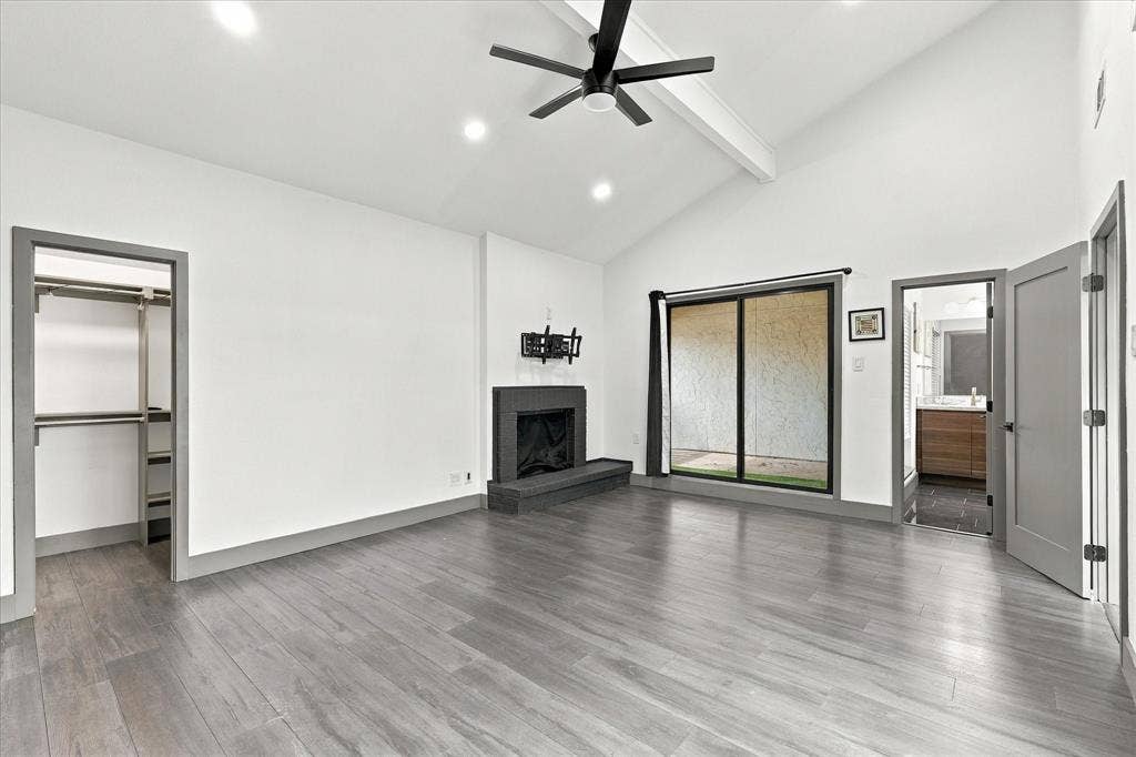 9232 Chimney Corner Lane, Dallas, TX 75243 Primary bedroom with fireplace and private balcony patio