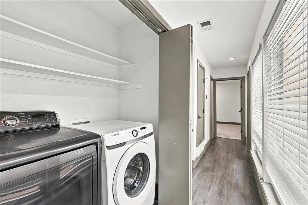 9232 Chimney Corner Lane, Dallas, TX 75243 Upstairs laundry in hallway