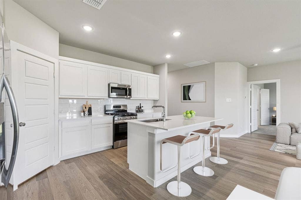 2021 Steeplechase Lane, Seagoville, TX 75159 Kitchen in the Harper home plan – REPRESENTATIVE PHOTO