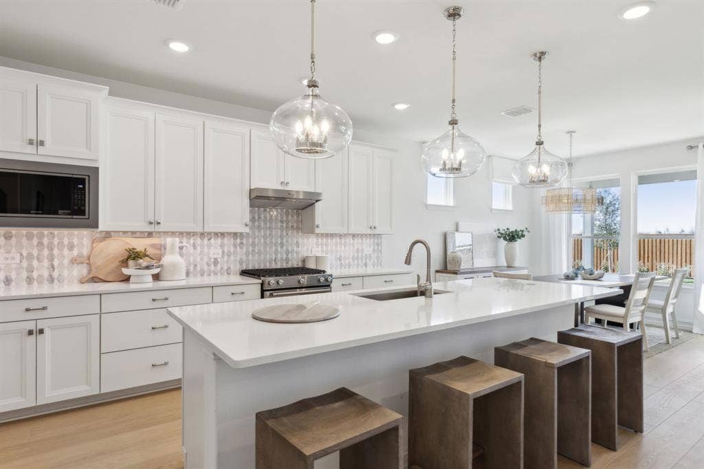 4337 Mickelson Avenue, Celina, TX 75009 *Model Representation - Spacious kitchen with eat-in bartop island