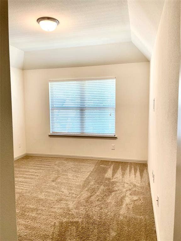 4213 Arbrook Way, Plano, TX 75074 Interior space featuring a vaulted ceiling, neutral wall tones, wall-to-wall carpeting, and a window fitted with horizontal blinds