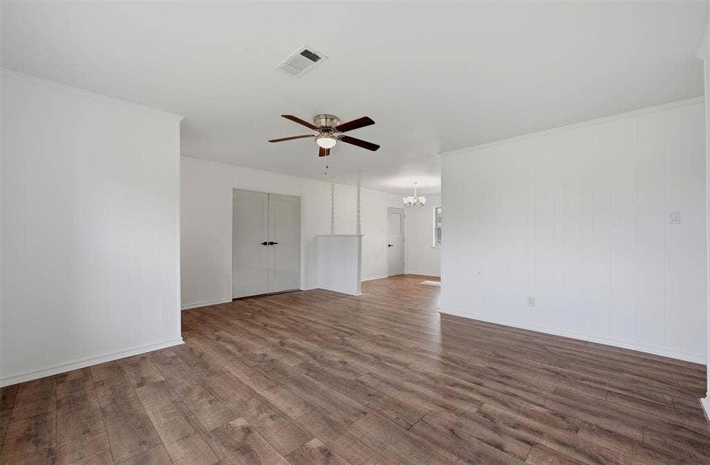 607 N Louisiana Drive, Celina, TX 75009 Interior space featuring wood-finish flooring, a ceiling fan with integrated lighting, and dual-panel closet doors