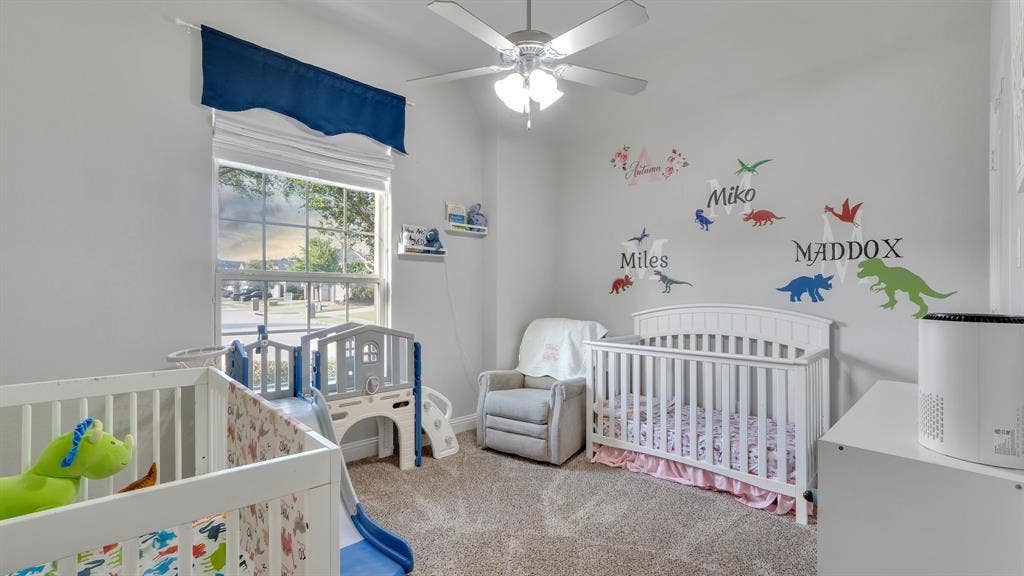 124 Village Creek Drive, McKinney, TX 75071 Bedroom featuring neutral wall paint, carpeted flooring, a vaulted ceiling with a central multi-blade ceiling fan, and a grid-pattern window