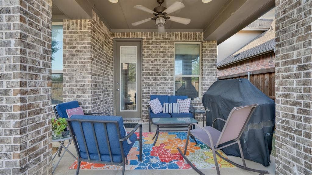 124 Village Creek Drive, McKinney, TX 75071 Covered patio featuring brick masonry columns, recessed lighting, and a ceiling-mounted fan