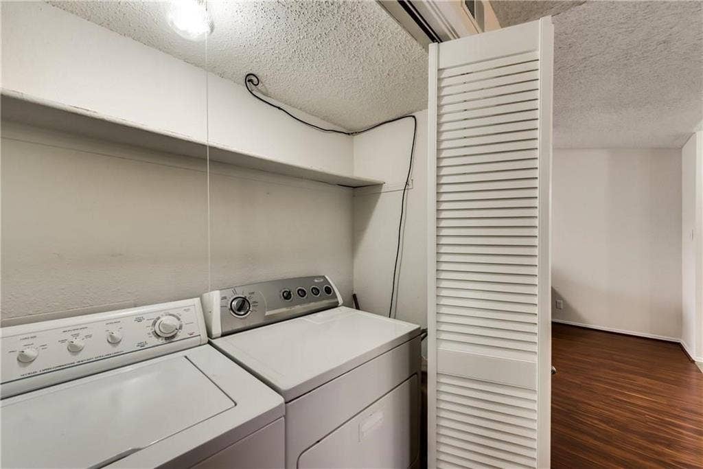 4748 Old Bent Tree Lane, #1102, Dallas, TX 75287 Washroom featuring dark hardwood / wood-style floors, a textured ceiling, and independent washer and dryer