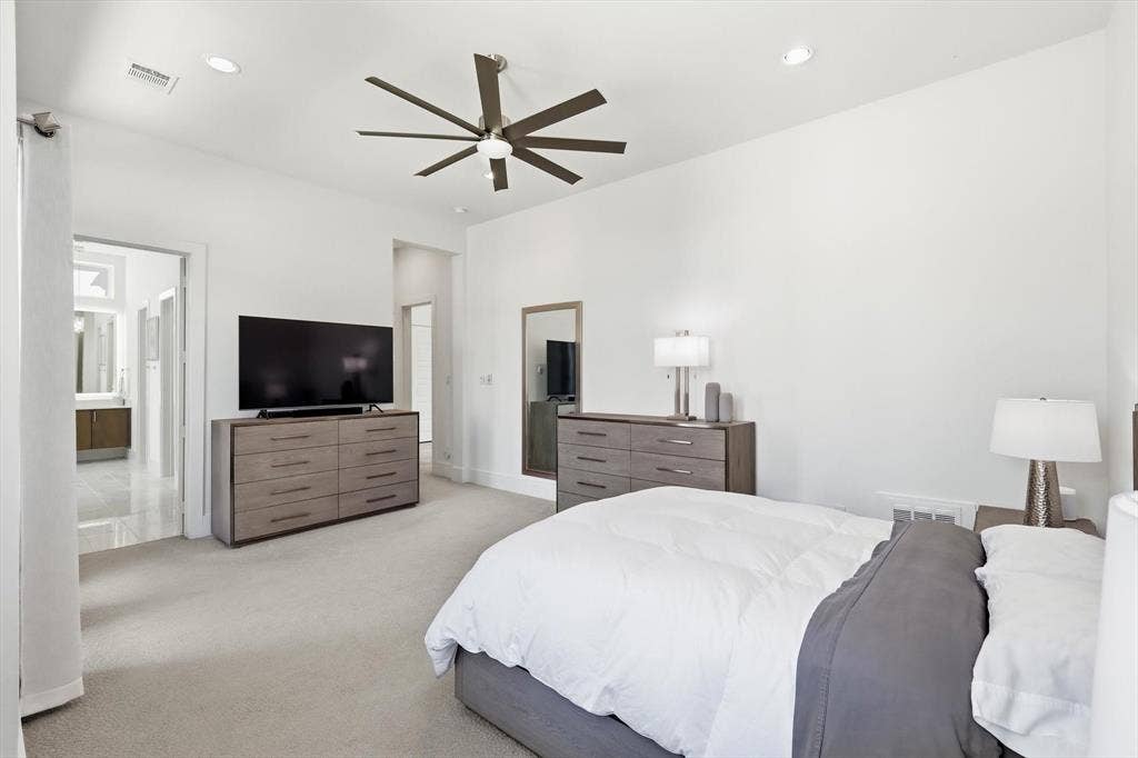 7853 Element Avenue, Plano, TX 75024 Spacious interior featuring high ceilings, neutral wall-to-wall carpeting, recessed lighting, and a multi-blade ceiling fan with integrated light fixture