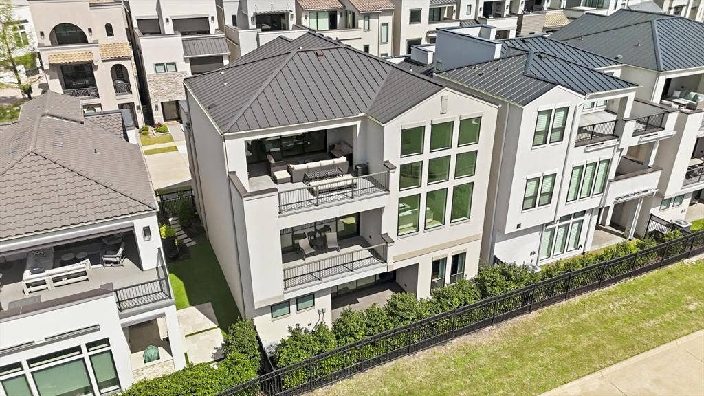 7853 Element Avenue, Plano, TX 75024 Multi-level exterior featuring a metal roof, stacked balconies with metal railings, and oversized floor-to-ceiling windows