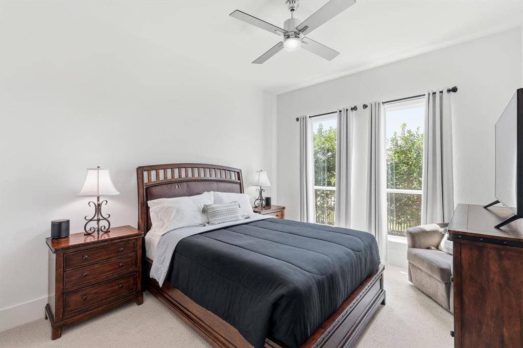 7853 Element Avenue, Plano, TX 75024 Neutral wall coloring, ceiling-mounted fan with integrated light, and two large vertical windows
