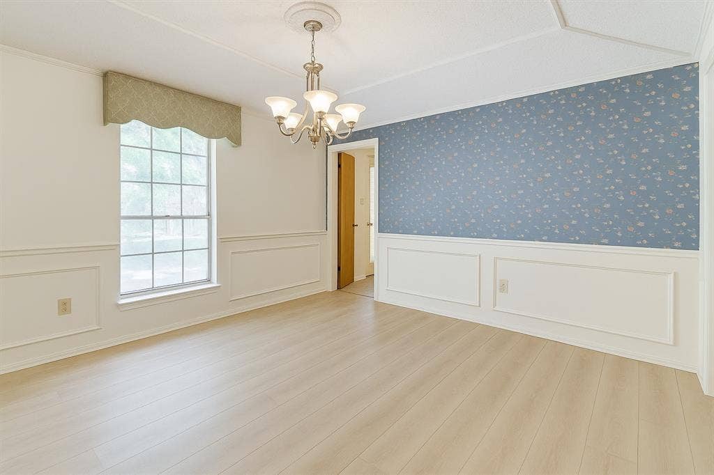 2007 Mistletoe Drive, Richardson, TX 75081 Dining room with a chandelier, a wainscoted wall, wood finished floors, and crown molding