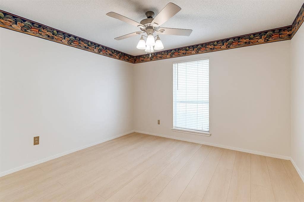 2007 Mistletoe Drive, Richardson, TX 75081 Bedroom with ceiling fan, light wood-type flooring, and baseboards