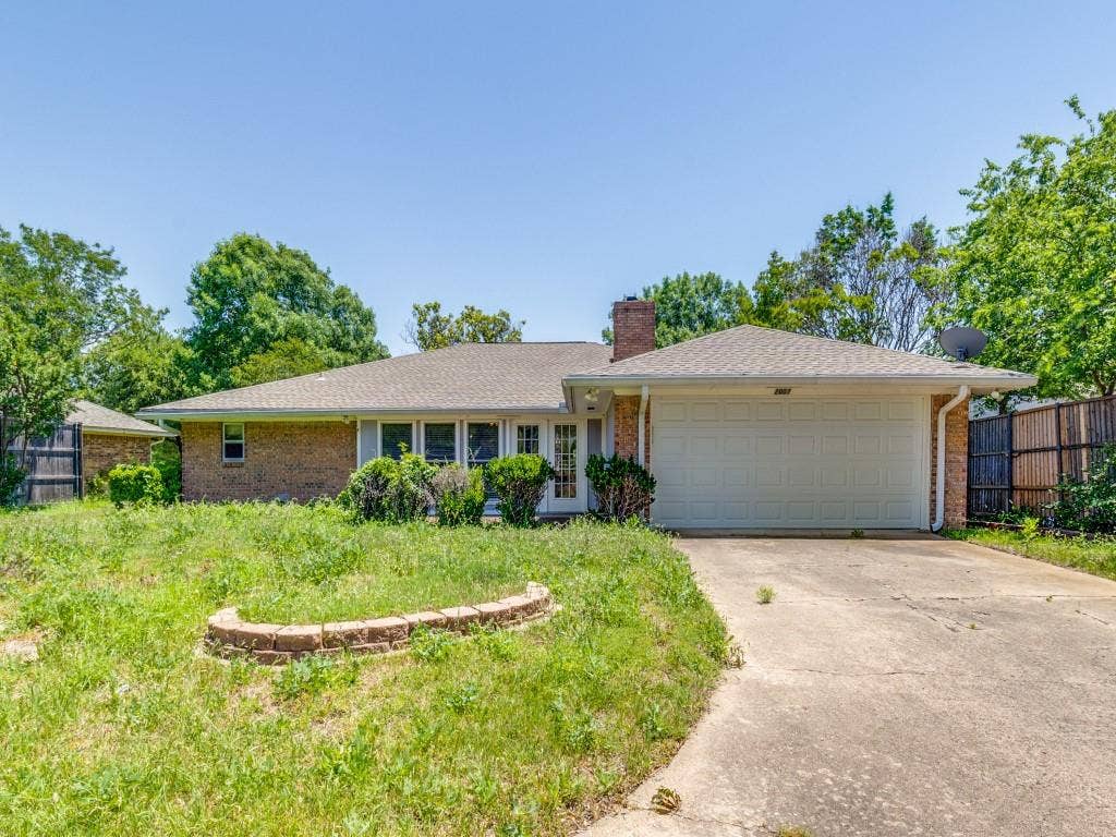 2007 Mistletoe Drive, Richardson, TX 75081 Ranch-style home with fence, a chimney, brick siding, an attached garage, and driveway