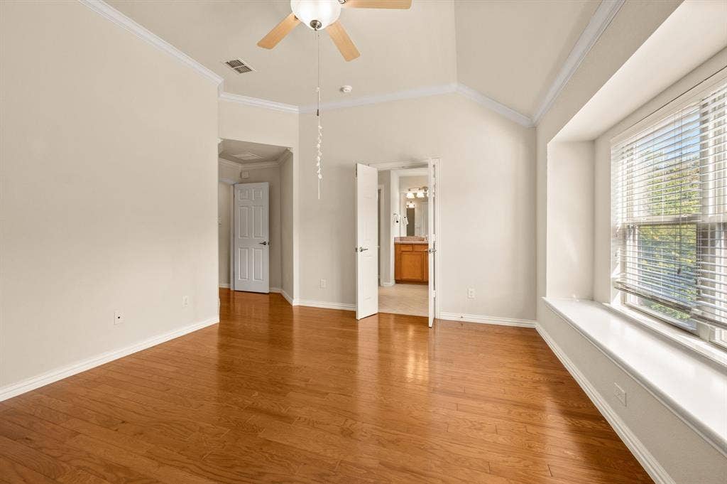 1712 Coronado Street, Allen, TX 75013 Vaulted ceilings, wood-finish flooring, built-in window seat, and ceiling fan fixture