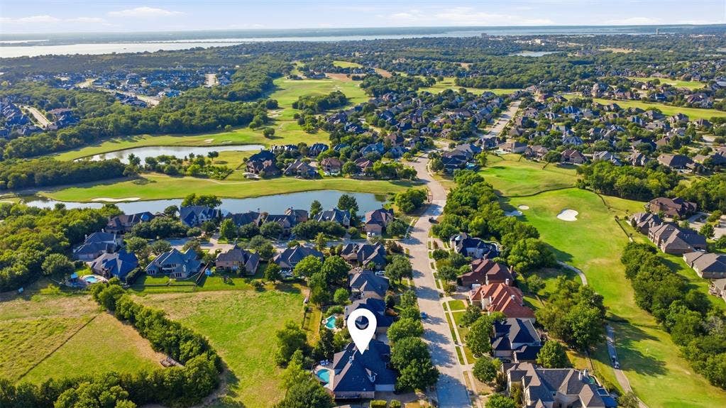 1919 Kings Pass, Heath, TX 75032 Expansive residential area with mature trees, green spaces, and a golf course and look at lake ray Hubbard in the horizon!