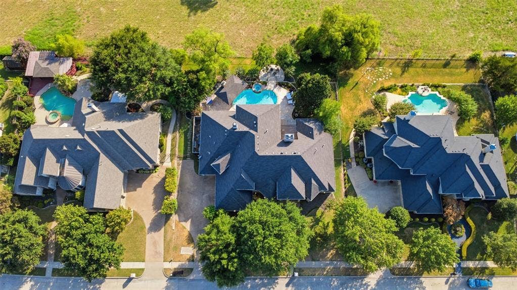 1919 Kings Pass, Heath, TX 75032 Paved driveways, mature trees, and swimming pools with integrated spas