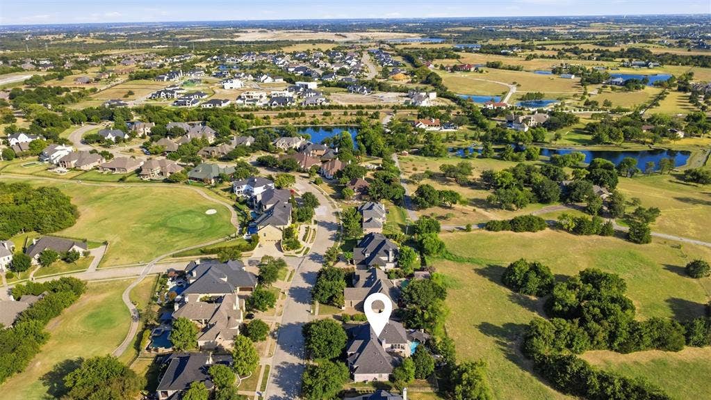 1919 Kings Pass, Heath, TX 75032 Aerial perspective of a residential neighborhood featuring established homes, mature trees, and a street network