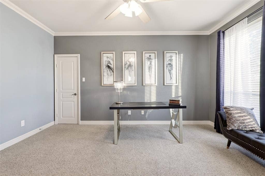 1919 Kings Pass, Heath, TX 75032 Crown molding, ceiling fan, white trim, light-colored carpeting, and a window with blinds