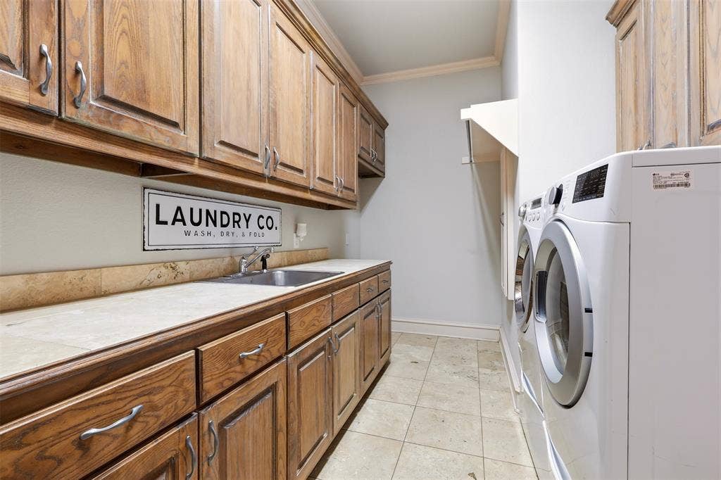 1919 Kings Pass, Heath, TX 75032 Wood-finish cabinetry, tile countertops with integrated sink, tile flooring, and integrated clothes hanging rack and room for Freezer or Refrigerator