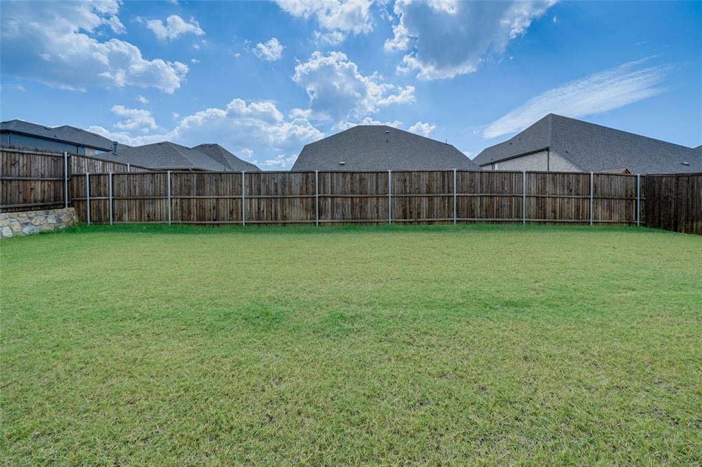 View of fenced backyard