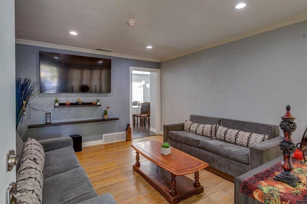 1600 Summit Street, Mesquite, TX 75149 Hardwood flooring, recessed lighting, crown molding, and tiered wall-mounted shelving