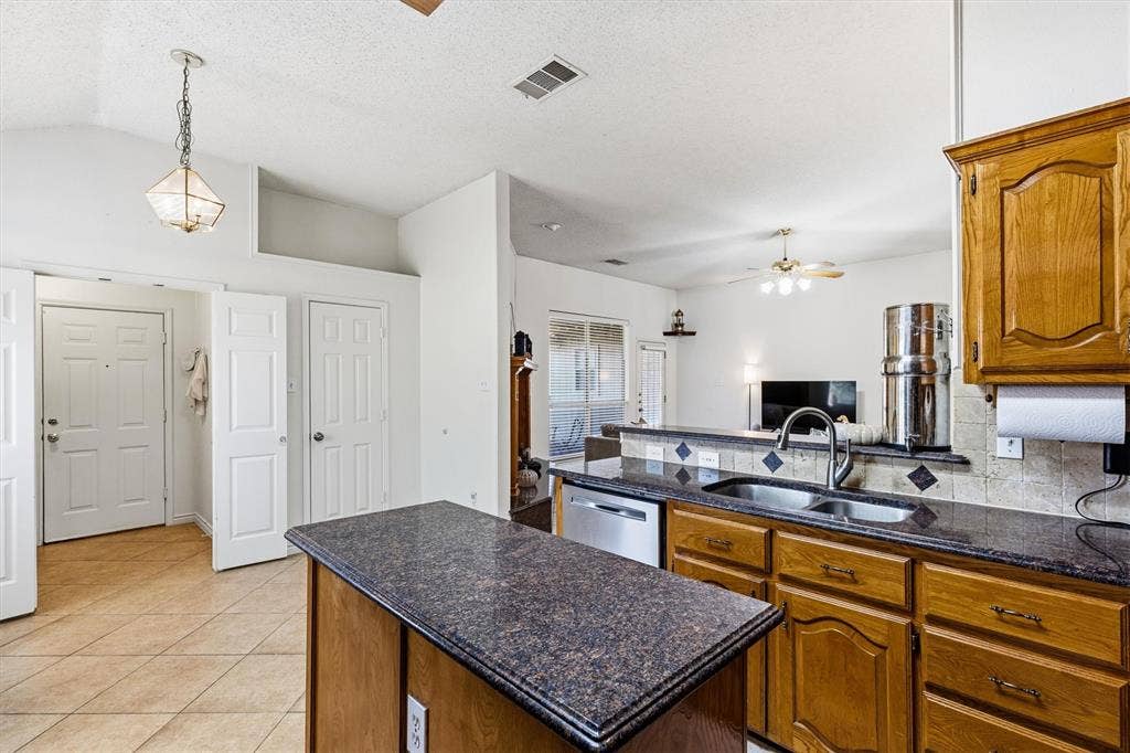 409 Danmire Drive, Murphy, TX 75094 A view out of the kitchen into the living room