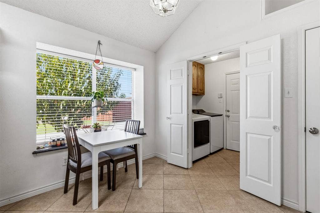 409 Danmire Drive, Murphy, TX 75094 The eat in kitchen breakfast area with picture window overlooking the backyard. Entry tot he garage is through the utility room