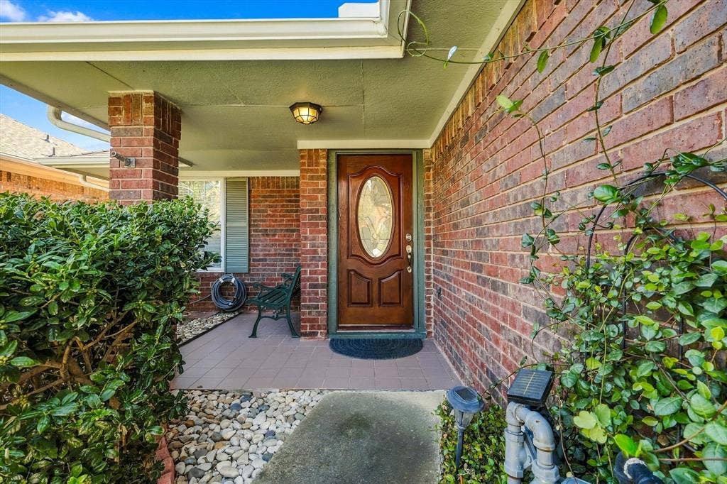 2524 Brooke Trail, Carrollton, TX 75006 Set back entrance offers privacy and secluded porch.
