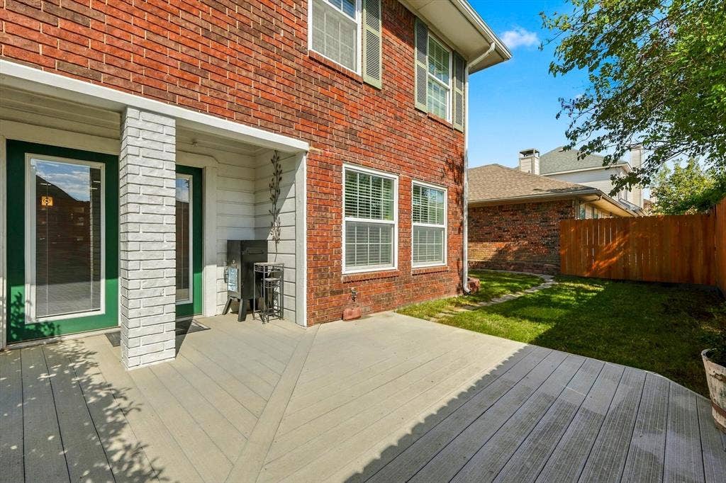 2524 Brooke Trail, Carrollton, TX 75006 Backyard offers a composite deck and six foot tall fence.