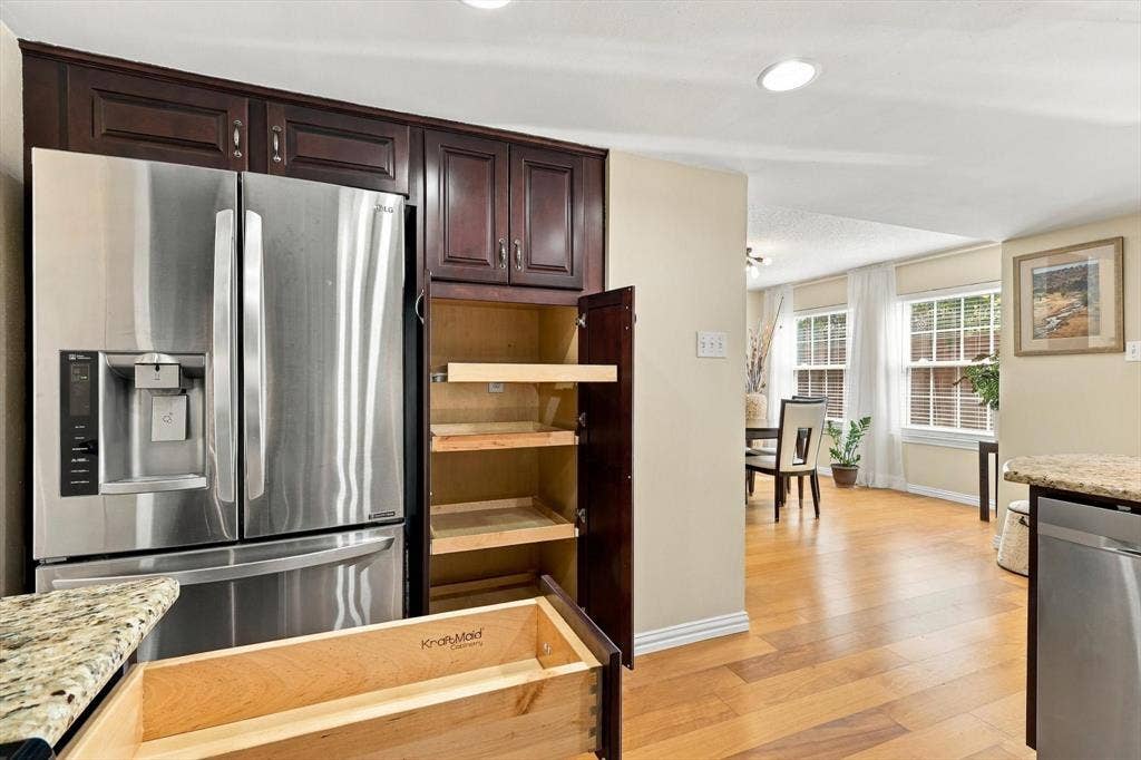 2524 Brooke Trail, Carrollton, TX 75006 Kraftmaid cabinets feature pull out shelves and corner lazy Susan.