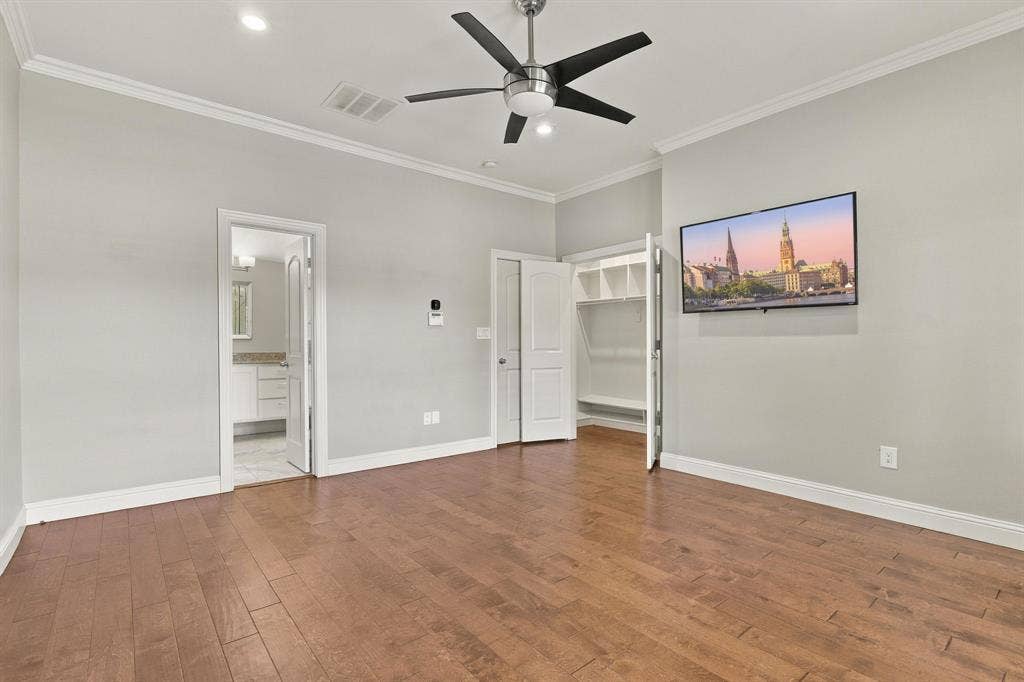 510 E Malone Street, Celina, TX 75009 Wood-finish flooring, brushed metal ceiling fan with integrated lighting, recessed lighting, and built-in closet shelving