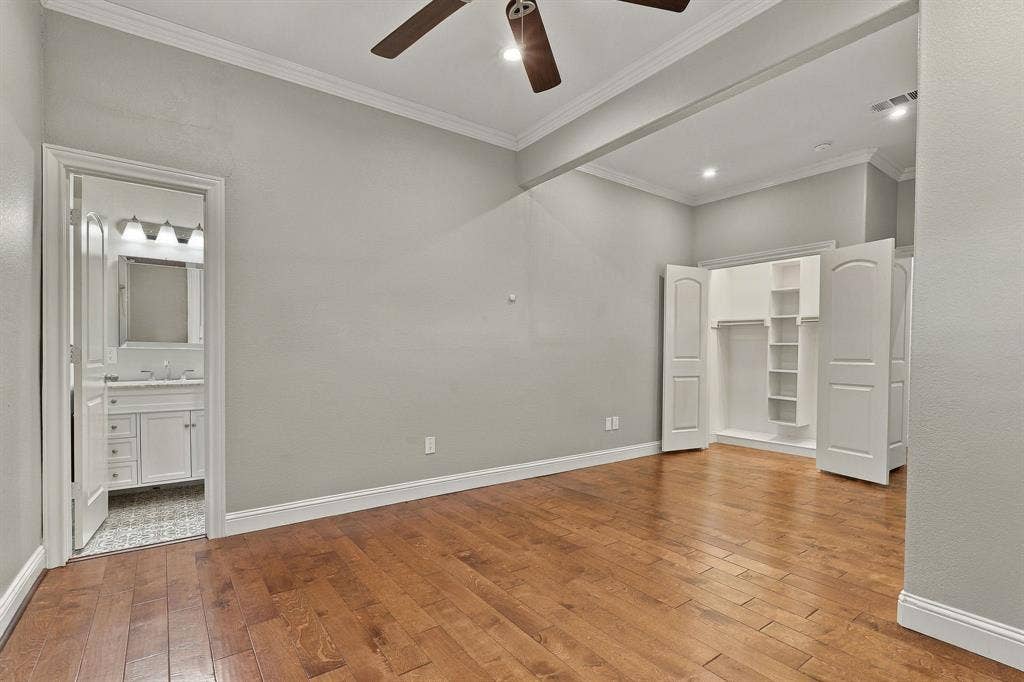 510 E Malone Street, Celina, TX 75009 Wood-finish flooring, crown molding, ceiling fan, and built-in closet shelving