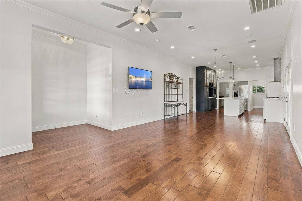 510 E Malone Street, Celina, TX 75009 Open-concept interior featuring wood-finish flooring, recessed lighting, ceiling fan, and crown molding