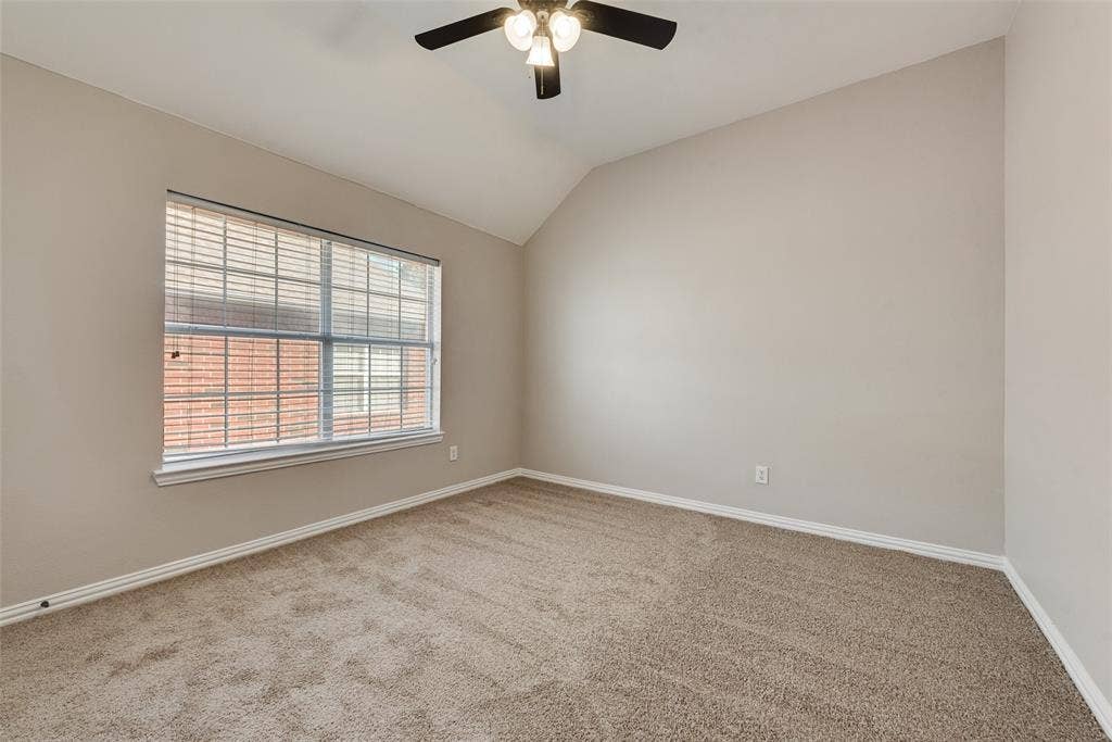 2017 Lunenburg Drive, Allen, TX 75013 Vaulted ceiling, neutral wall tones, wall-to-wall carpeting, multi-pane window, and a central ceiling fan with an integrated light fixture