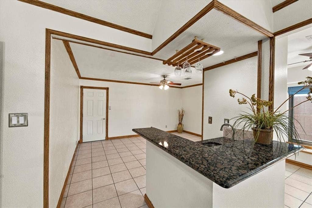 1508 Heidi Drive, Plano, TX 75025 Wet bar with granite counter top = kitchen to the right and door to the garage - all walls painted 10/26