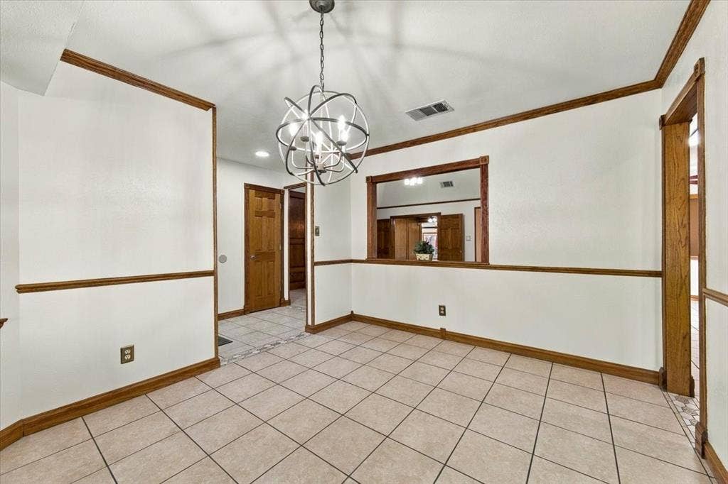 1508 Heidi Drive, Plano, TX 75025 Formal dining room with a bay window facing the street - opening to the kitchen