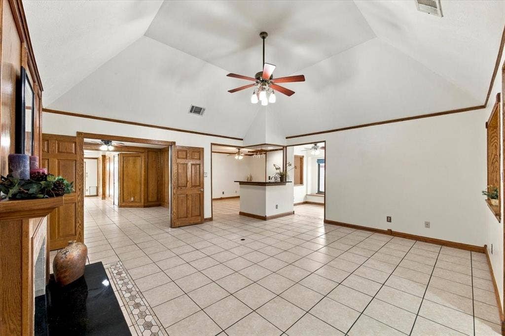 1508 Heidi Drive, Plano, TX 75025 Great view with the Open Concept - slightly vaulted ceiling with ceiling fan - all with walls painted 10-2026Notice the doors to the office. Electric outlet in the floor