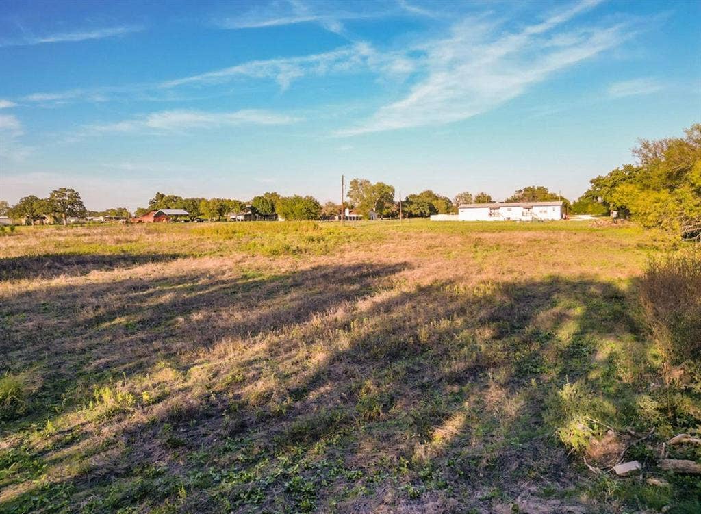 3659 N Katy Road, Ross, TX 76640 Expansive parcel featuring mature trees, level topography, and open meadow acreage