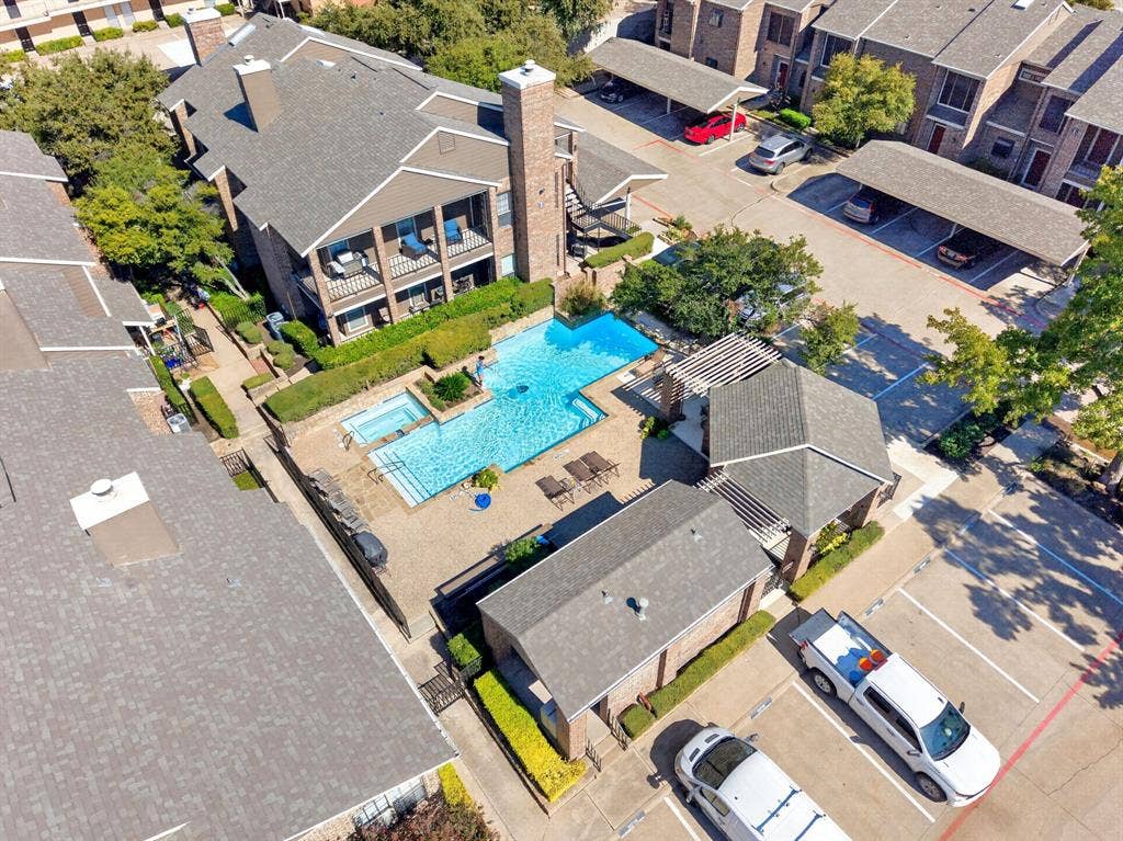 5859 Frankford Road, #1209, Dallas, TX 75252 Community pool area featuring an in-ground swimming pool, integrated spa, and covered pergola structures