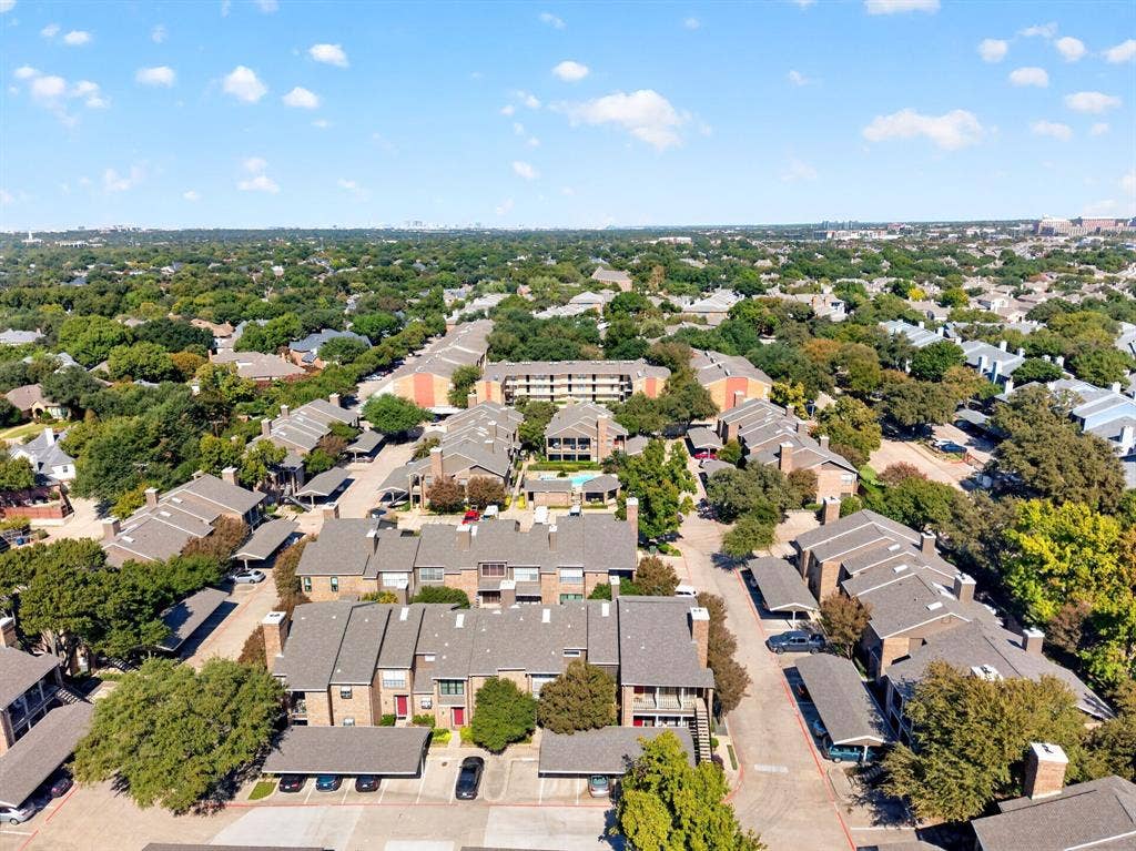 5859 Frankford Road, #1209, Dallas, TX 75252 Aerial perspective of a multi-unit complex featuring shingled roofs, brick and masonry siding, covered parking structures, and mature landscaping