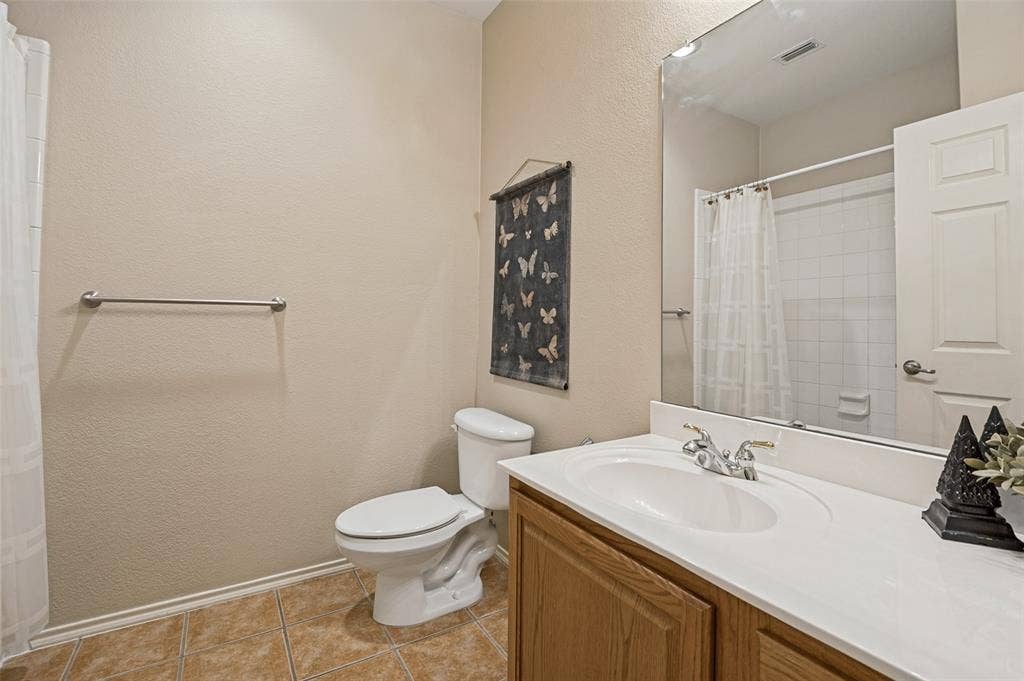 7225 Rembrandt Drive, Plano, TX 75093 secondary bath with tub shower