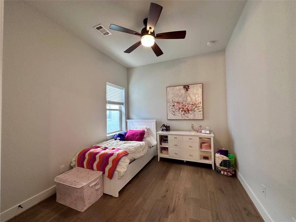 2712 War Admiral Street, Celina, TX 75009 Room featuring high ceilings, wood-finish flooring, and a ceiling fan with integrated lighting