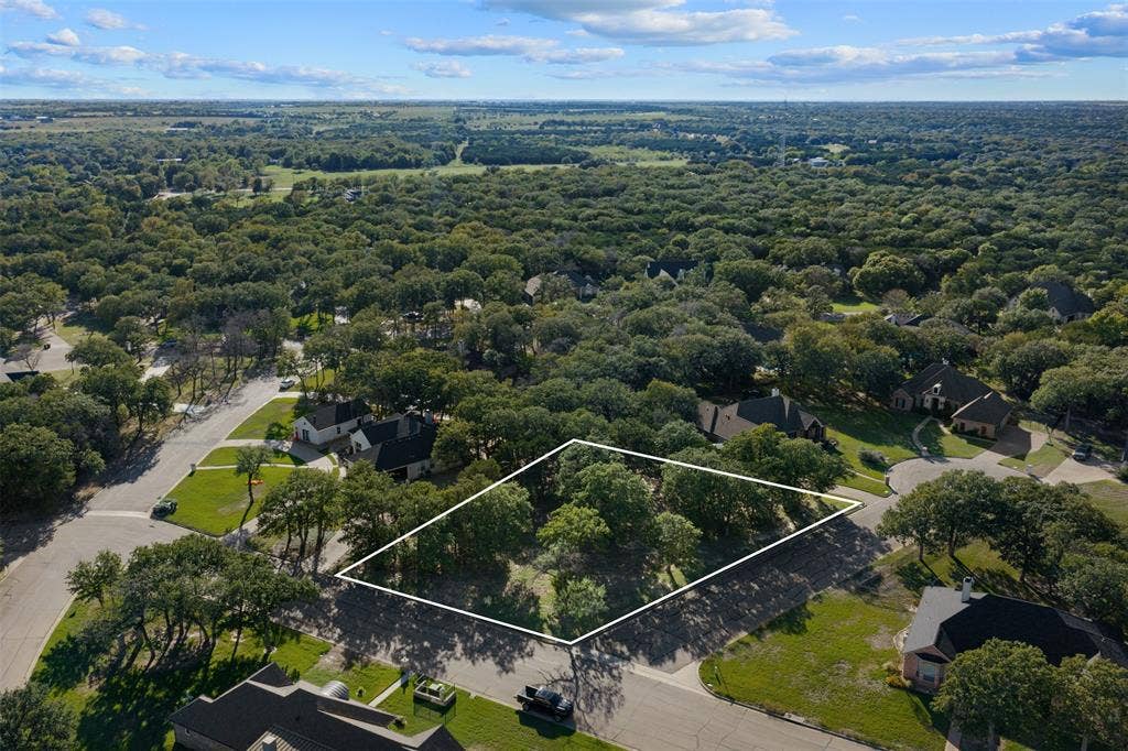 1027 Dominion Oaks Drive, China Spring, TX 76633 Corner lot featuring mature hardwood trees and established residential infrastructure with approximate boundaries marked