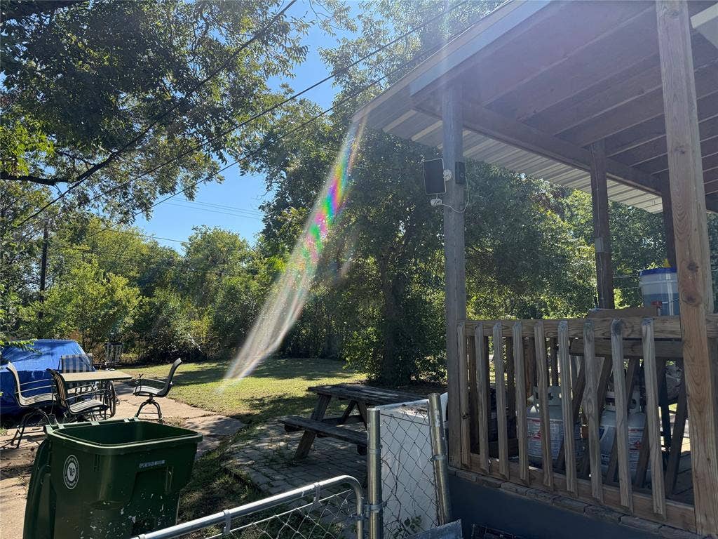 2716 Lyle Avenue, Waco, TX 76708 Covered wooden porch featuring exposed rafters, a wooden rail system, and integrated post support
