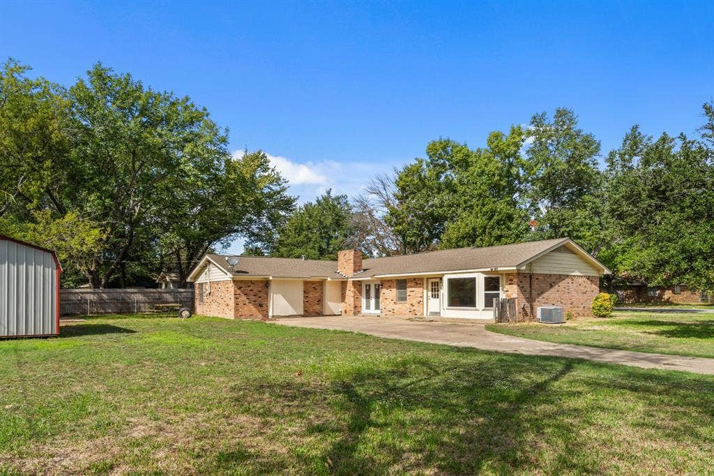 2729 Tanglewood Drive, Commerce, TX 75428 Large backyard and rear entry garage
