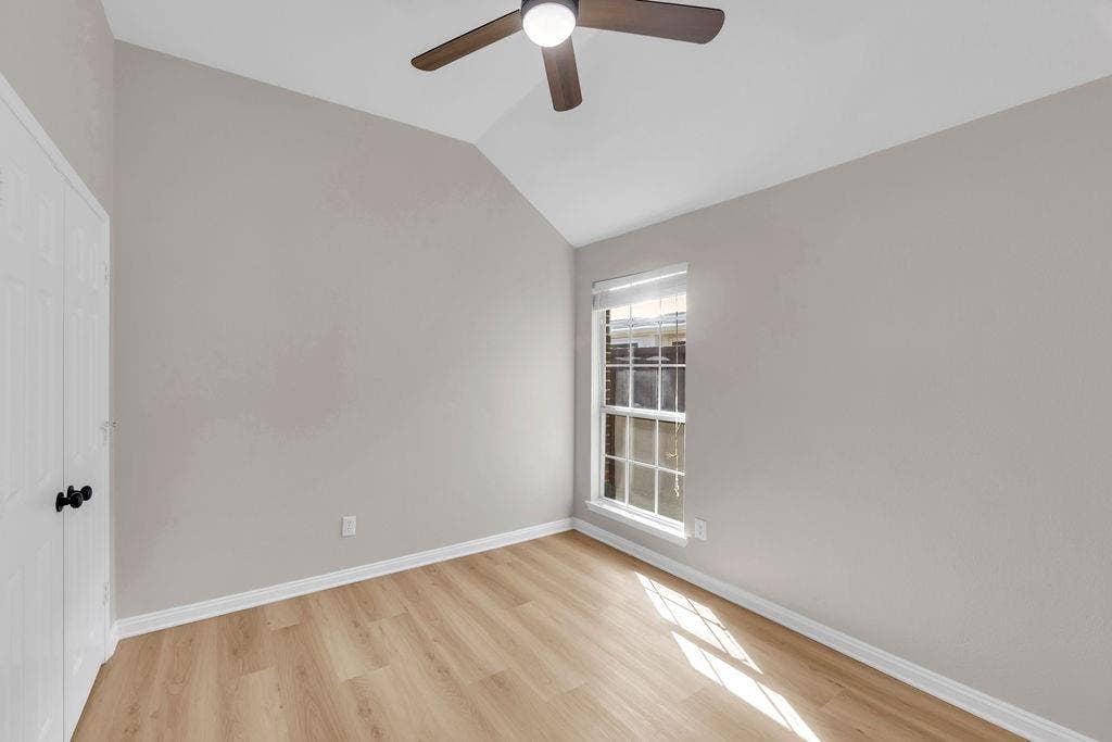 12109 Biloxi Drive, Frisco, TX 75035 Vaulted ceiling room featuring light-tone wood-finish flooring, a ceiling fan with integrated lighting, and a double-door closet