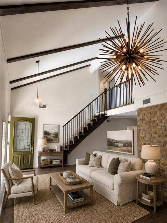 3210 Cortez Court W, Irving, TX 75062 Vaulted ceilings with exposed beams, starburst chandelier, staircase featuring metal balusters, and floor-to-ceiling textured stone accent wall