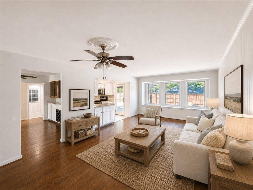 3210 Cortez Court W, Irving, TX 75062 Living area featuring wood-finish flooring, a ceiling fan with decorative medallion, beadboard wall detailing, and a triple window configuration